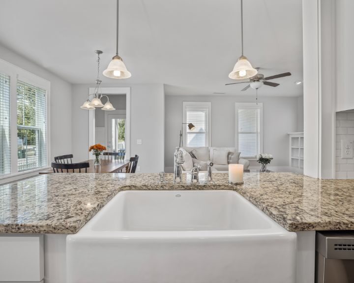 granite-kitchen-countertops-sarasota-fl-720x576px Modern kitchen with granite countertop and island sink.
