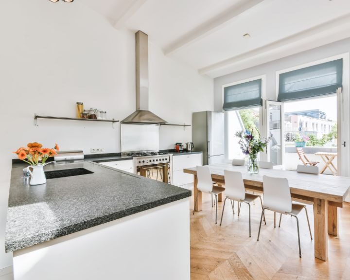 a kitchen with a center island and a stove top oven.