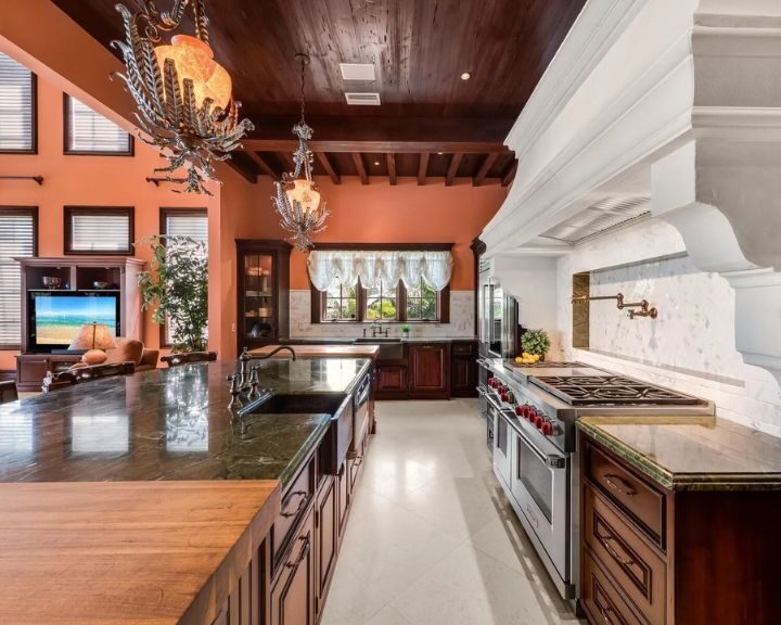 kitchen-remodel-sarasota-fl-720x576px Spacious luxury kitchen with island and chandeliers.