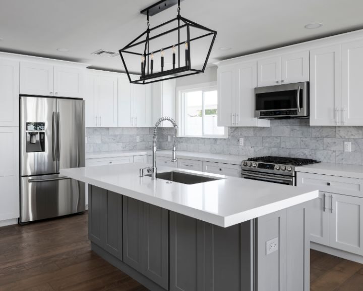 modern-kitchen-cabinets-sarasota-fl-720x576px Modern kitchen with island and stainless steel appliances.