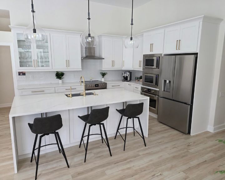 modern-kitchen-refurbishment-sarasota-fl-720x576px Modern kitchen with white cabinets and island.